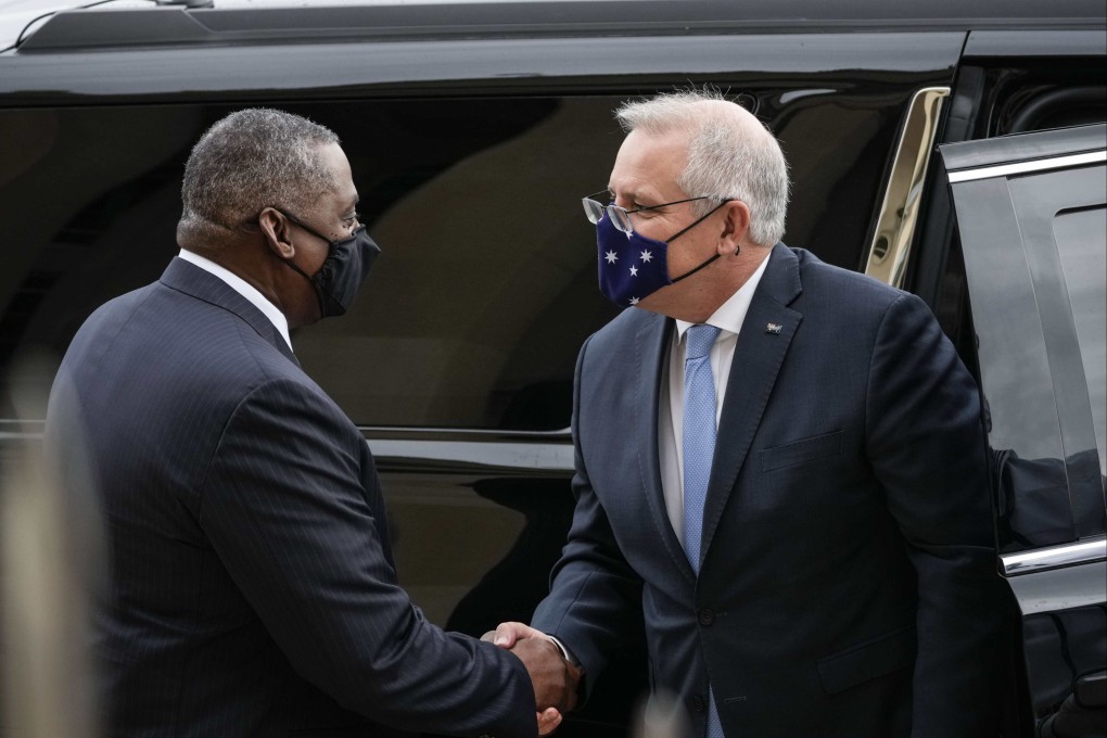 US Secretary of Defence Lloyd Austin (left) greets Australian Prime Minister Scott Morrison as he arrives at the Pentagon in Arlington, Virginia, on September 22. In mid-September, Australia, the United States and the United Kingdom announced a security pact, Aukus, to help Australia develop and deploy nuclear-powered submarines, in addition to other military cooperation.   Photo: AFP