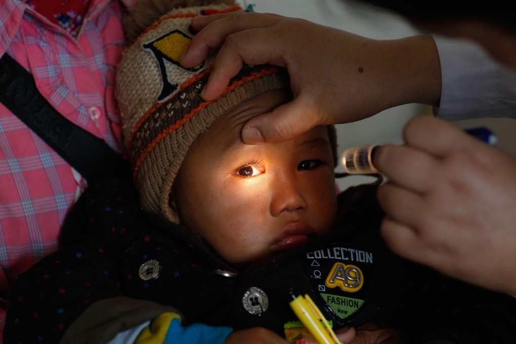 A boy from a rural area in Yunnan, China, receives cataract treatment from an NGO in 2018. Photo: Handout