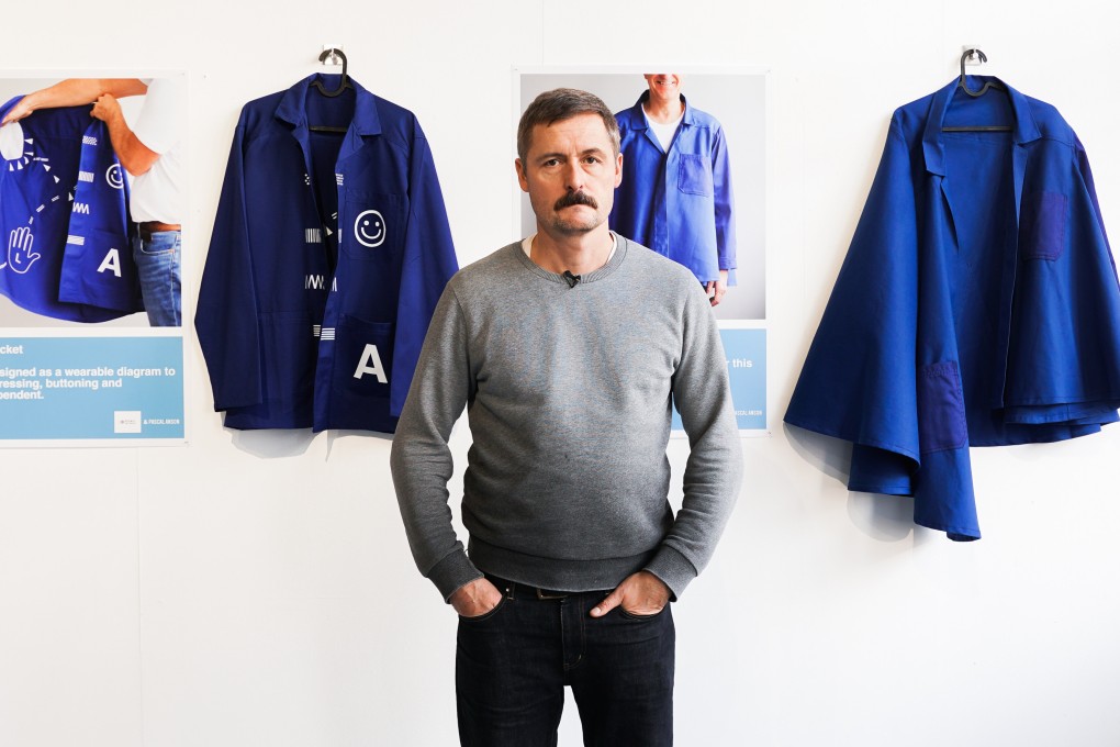 Pascal Anson poses with jackets he designed that are both wearable by and instructive for those living with dementia. They feature in the first OK Dementia Festival in Hong Kong. Photo: Enable Foundation