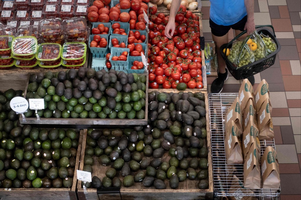 A person shops at a grocery store in Washington DC, on August 12, as a US report showed inflation rising significantly on the back of energy and food prices. Photo: AFP