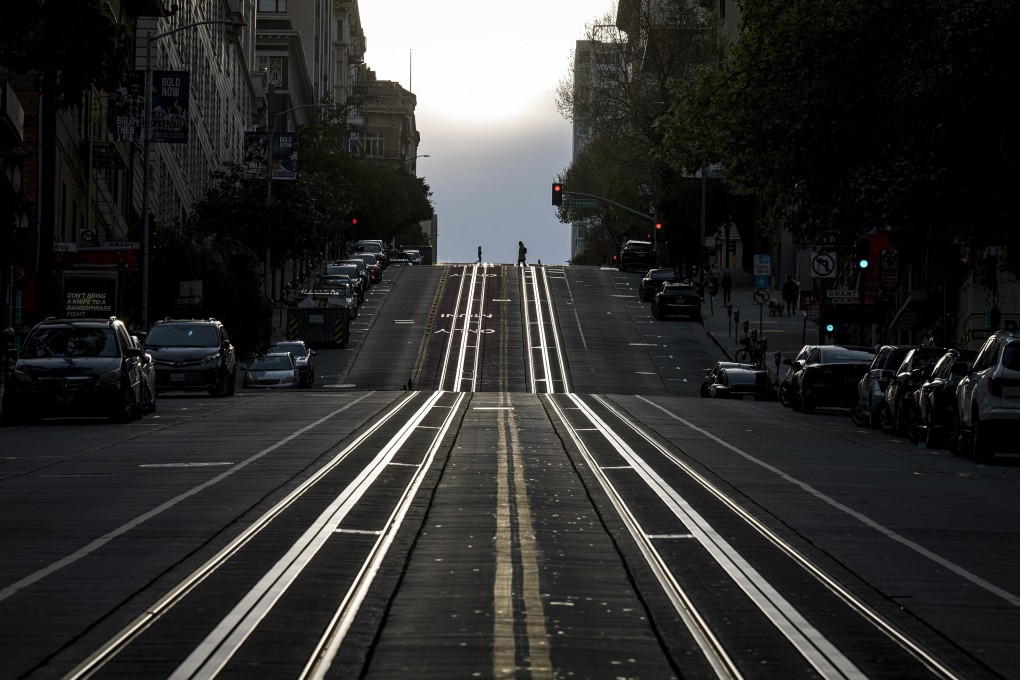 Pedestrians cross an almost deserted California Street in San Francisco amid the pandemic on March 17, 2020. Remote work is allowing people to relocate to less expensive places than the Golden City. Photo: Bloomberg