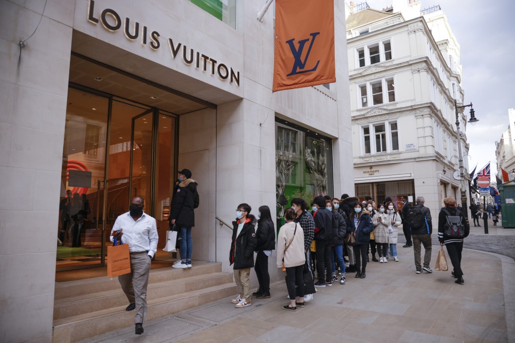 Shoppers wait in line to enter a Louis Vuitton store in London on April 12. Retail real estate in Western economies has been ravaged by lockdowns and the rapid acceleration of online shopping. Photo: Bloomberg