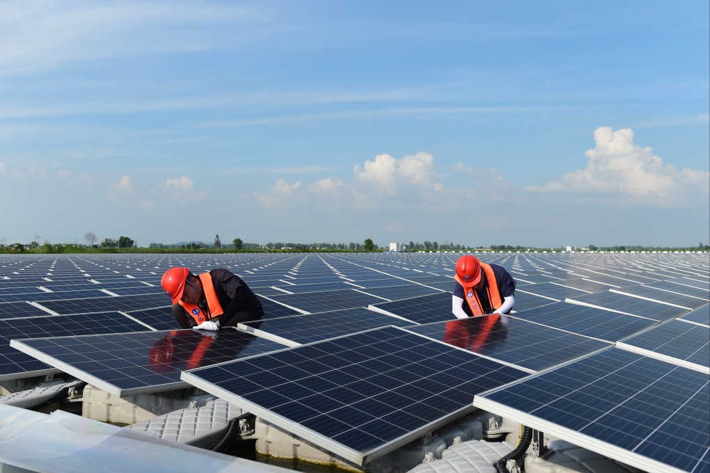 Engineers conduct maintenance work at a floating solar farm in Huainan, in eastern Anhui province. China currently generates around a quarter of its electricity from renewables. Photo: Xinhua