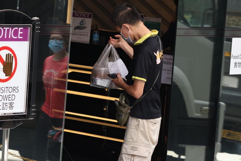 Food is dropped off at a quarantine hotel in Tsuen Wan, Hong Kong. Occupants of rooms in some hotels have stolen home-cooked meals delivered to their neighbours. Photo: Nora Tam