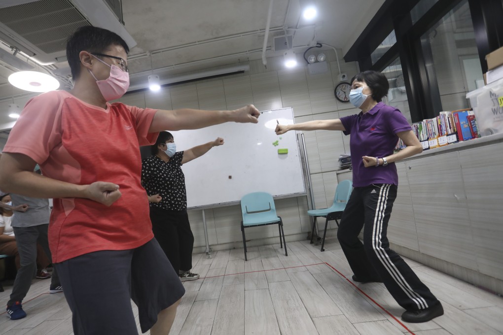Alice Lee, 65, (right), a volunteer at Agency for Volunteer Service, teaches a tai chi class at Baptist Oi Kwan Social Service in Jordan. Kowloon. Volunteering and positive thoughts keep the retired Hong Kong police officer feeling youthful, she says. Photo: SCMP/Jonathan Wong