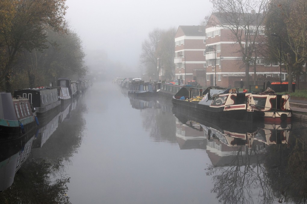 Houseboats moored on Regents Canal, London, the setting for Paula Hawkins’ third novel, A Slow Fire Burning. Photo: Getty Images