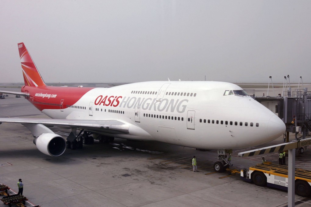 An Oasis Hong Kong Airlines Boeing 747-400 at the departure gate at Hong Kong International Airport before the carrier’s inaugural flight on October 25, 2006. Photo: Reuters