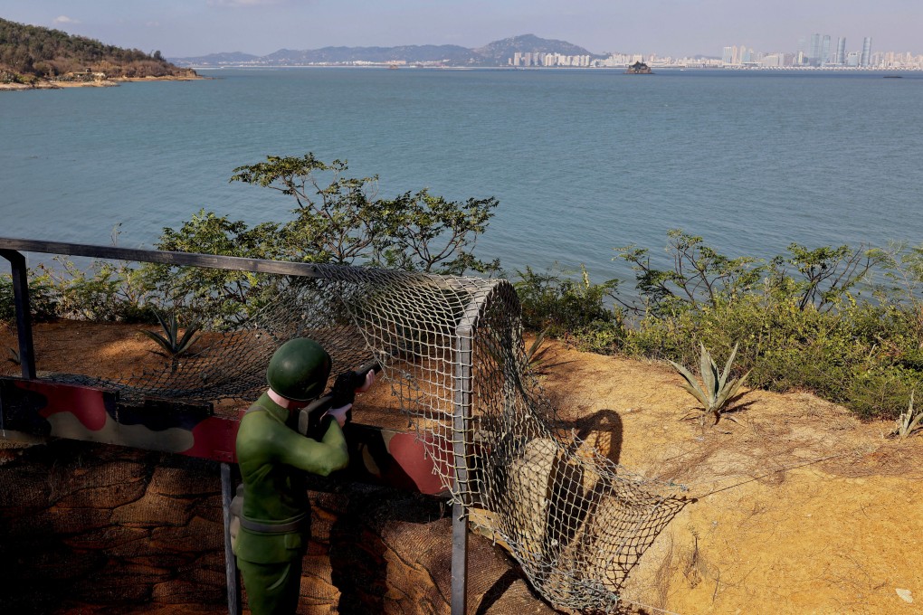 A mannequin of a soldier aims in the direction of the mainland on the coast of Lieyu, Taiwan, on October 19. Photo: Reuters
