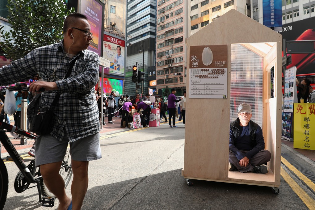 A nano-flat exhibit organised by the Hong Kong Platform Concerning Subdivided Flats attracts attention in a pedestrian zone in Causeway Bay on January 20, 2019. Photo: Nora Tam