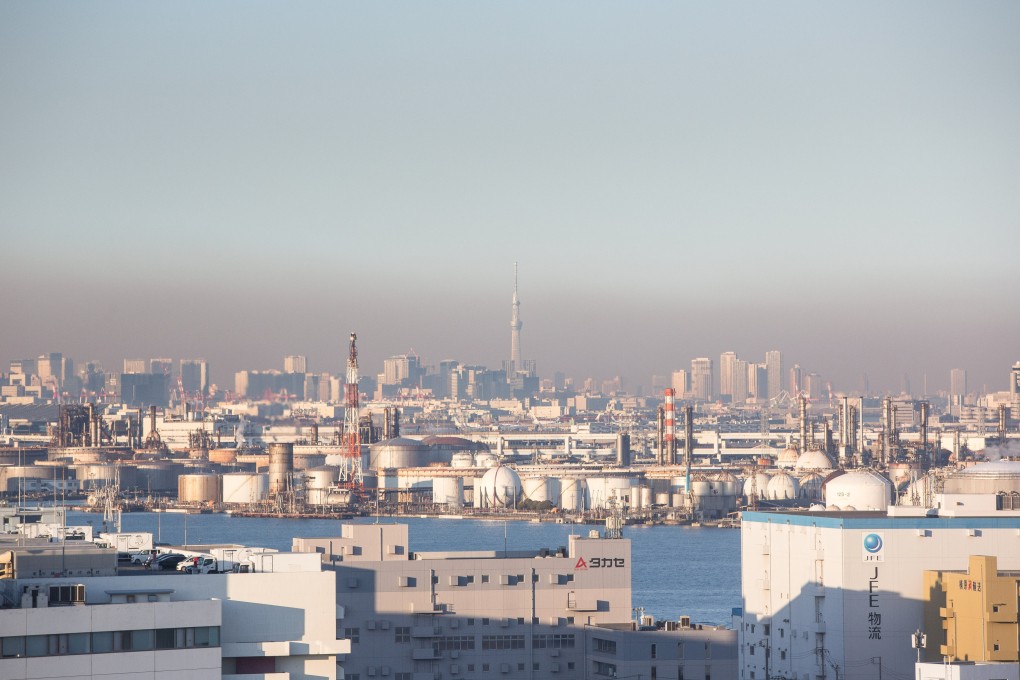 Climate change worries Asians, but not enough to stop using fossil fuels. Tokyo covered in a smog cloud. Photo: Stanislav Kogiku /SOPA Images/LightRocket via Getty Images
