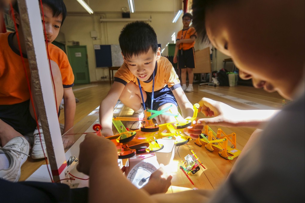 Students at a school in Yau Tong, Hong Kong, prepare for a robot race in May 2018. Photo: Xiaomei Chen