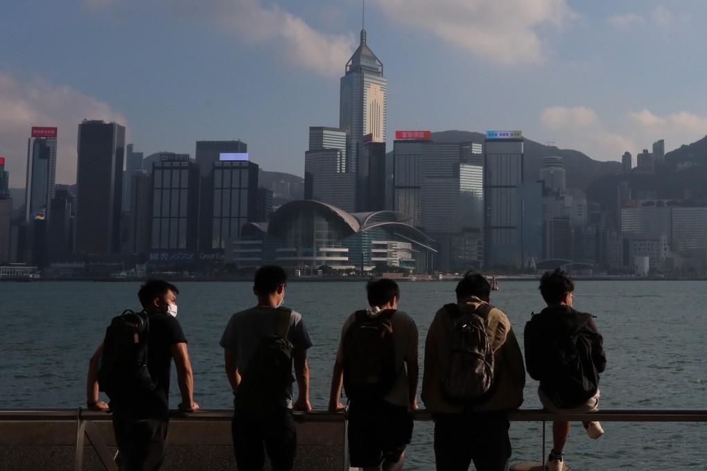Young people look across Victoria Harbour from the Tsim Sha Tsui promenade on November 1. Hong Kong’s Basic Law, which came into force in 1997, states that the city’s “previous capitalist system and way of life shall remain unchanged for 50 years”. Photo: Felix Wong