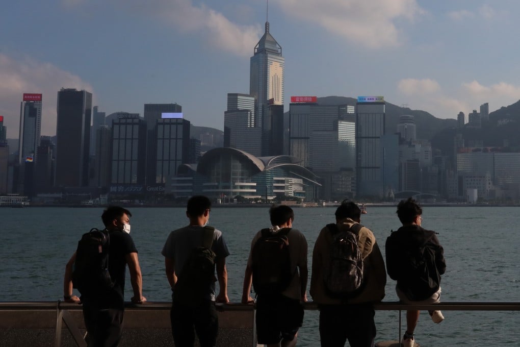 Young people look across Victoria Harbour from the Tsim Sha Tsui promenade on November 1. Hong Kong’s Basic Law, which came into force in 1997, states that the city’s “previous capitalist system and way of life shall remain unchanged for 50 years”. Photo: Felix Wong