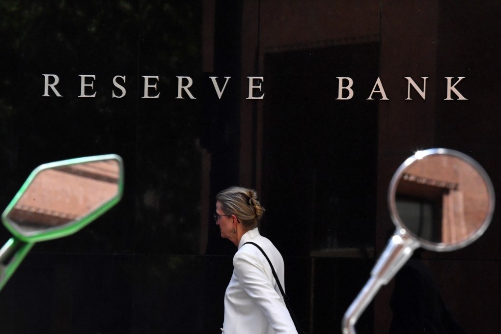 A pedestrian walks past the Reserve Bank of Australia head office in Sydney on November 2. Photo: EPA-EFE