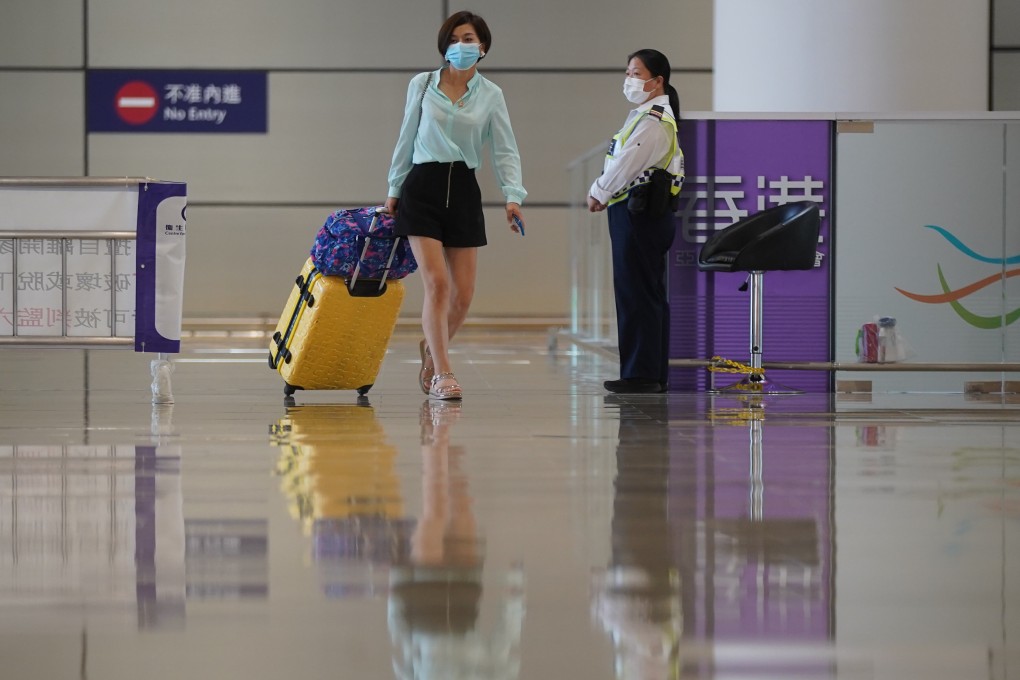 A woman crosses into Hong Kong on September 15. Only limited groups of people have been able to enter the city from the mainland, causing tremendous stress among the business community and local residents. Photo: Sam Tsang