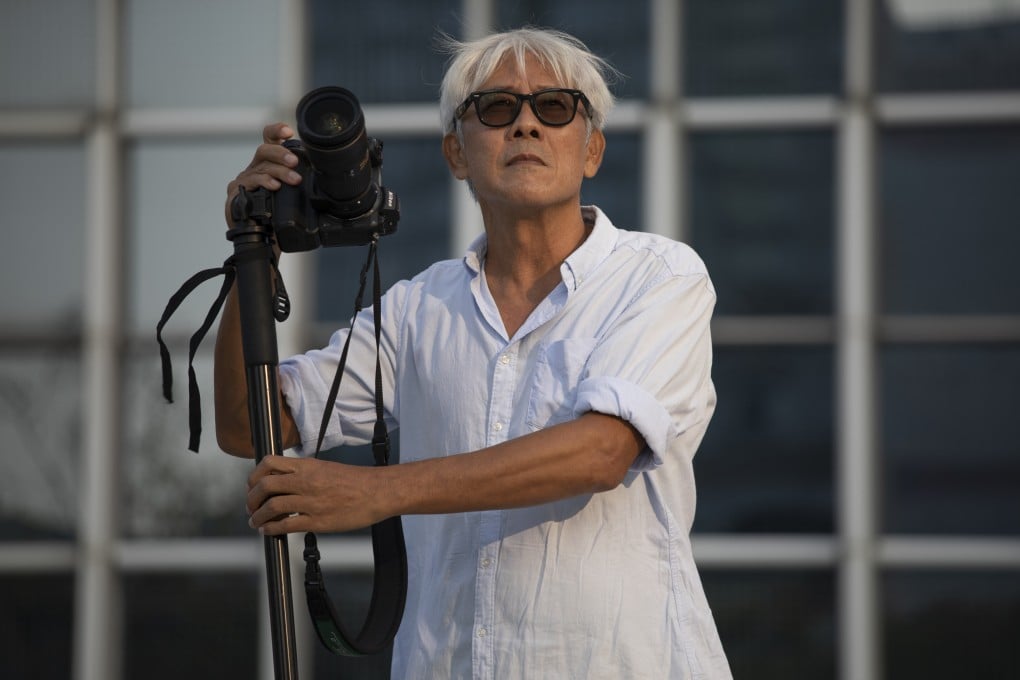 Hong Kong photographer John Fung at the IFC in Central, Hong Kong. He says living in the present is what informs his art. Photo: Antony Dickson