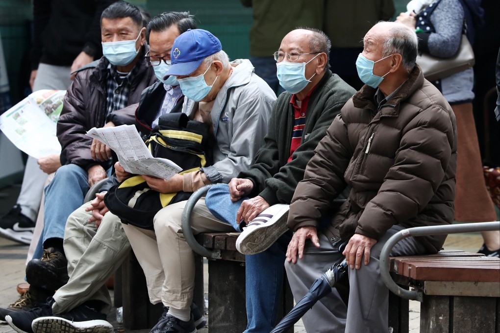 Elderly men sit on a bench in Sham Shui Po on December 23, 2020.  Surveys show the biggest concern for people in retirement is outliving their savings. Photo: Jonathan Wong