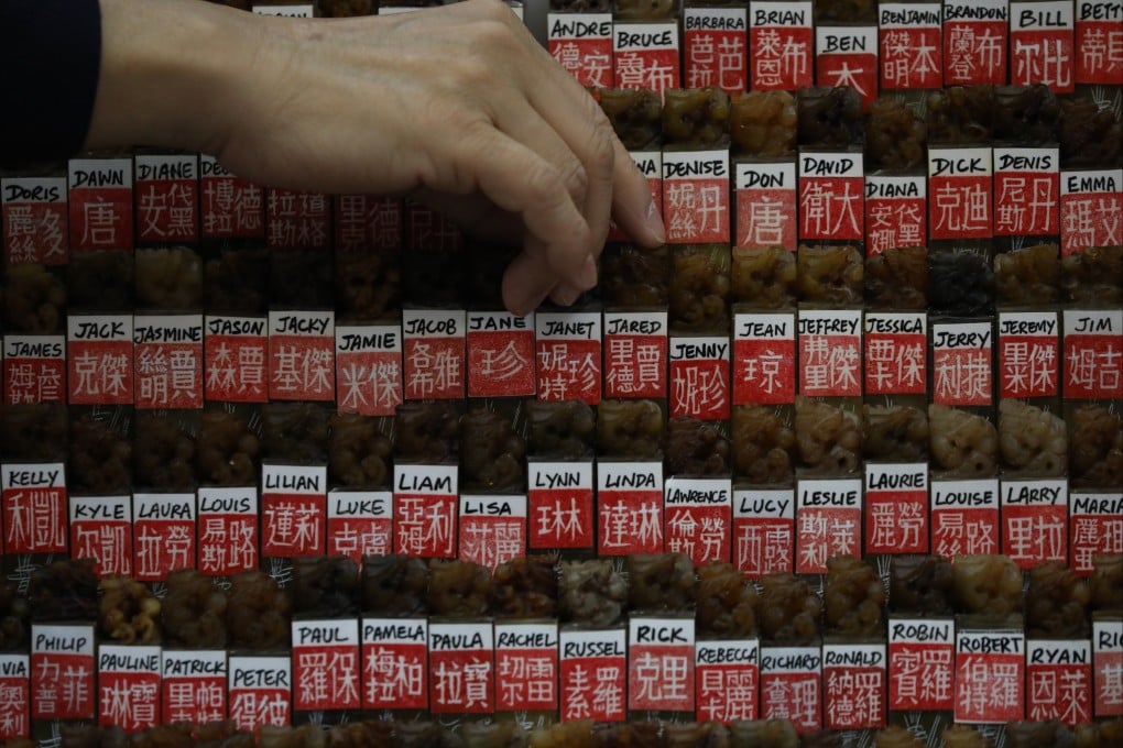 Traditional seals engraved with Chinese renderings of English names are displayed in a souvenir shop in Tsim Sha Tsui. Mastery of Chinese and English enables young people to pursue career goals and achieve upward social mobility. Photo: Nora Tam