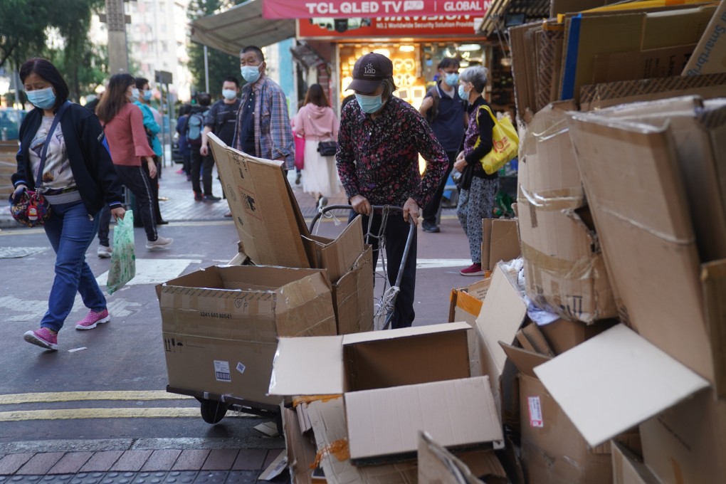 An elderly woman collects cardboard in Sham Shui Po on November 15. Photo: Sam Tsang