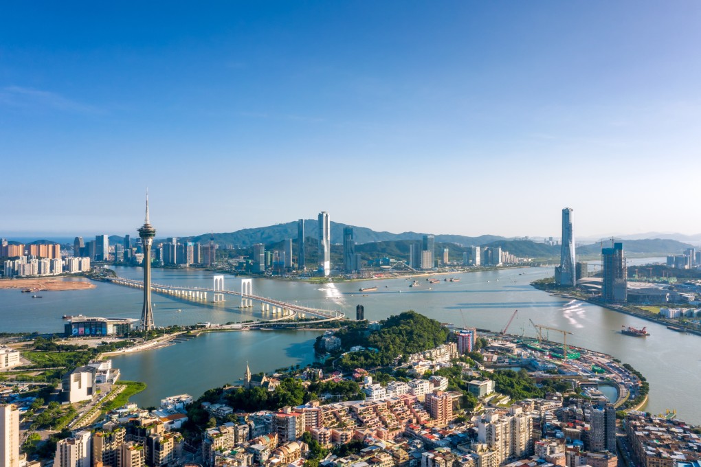 Aerial view of buildings in China’s Hengqin New Area (top) and residential buildings in Macau (bottom) on August 17, 2021. Photo: VCG via Getty Images