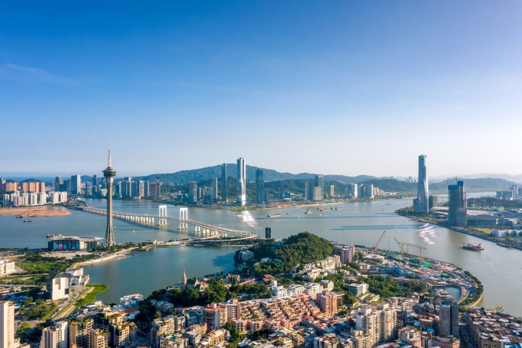 Aerial view of buildings in China’s Hengqin New Area (top) and residential buildings in Macau (bottom) on August 17, 2021. Photo: VCG via Getty Images