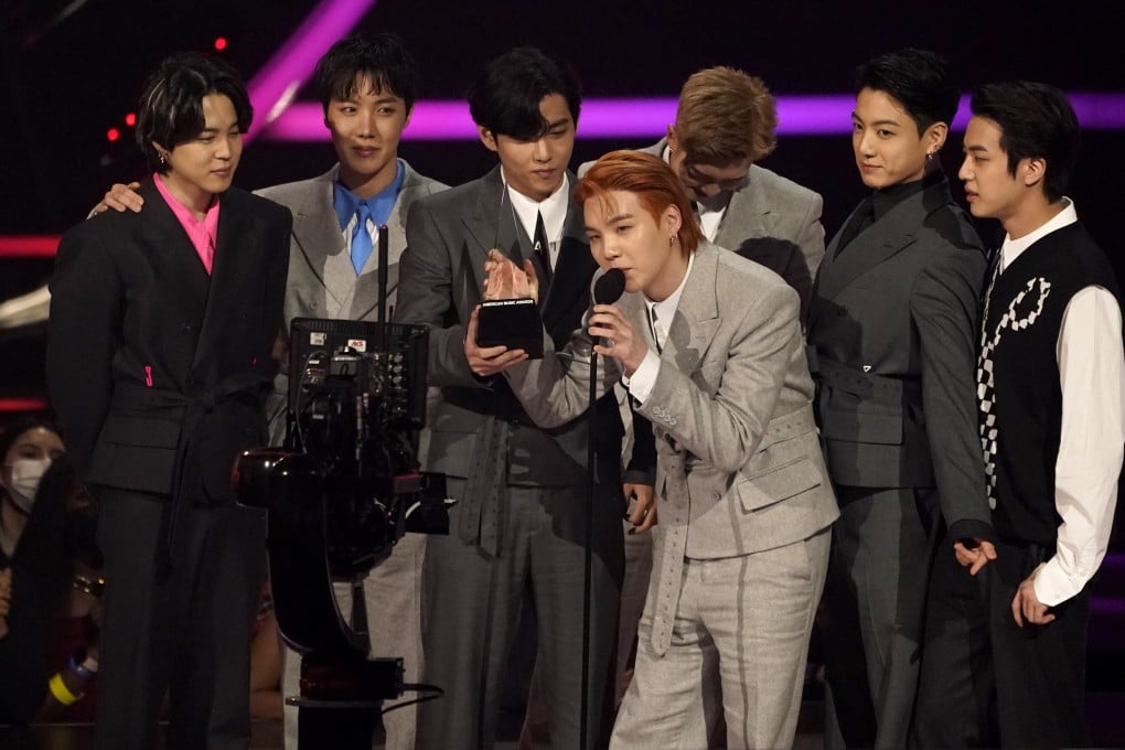 BTS accept the award for artist of the year at the American Music Awards on Sunday in Los Angeles. The K-pop band are the first Asian act to win the award. Photo: AP