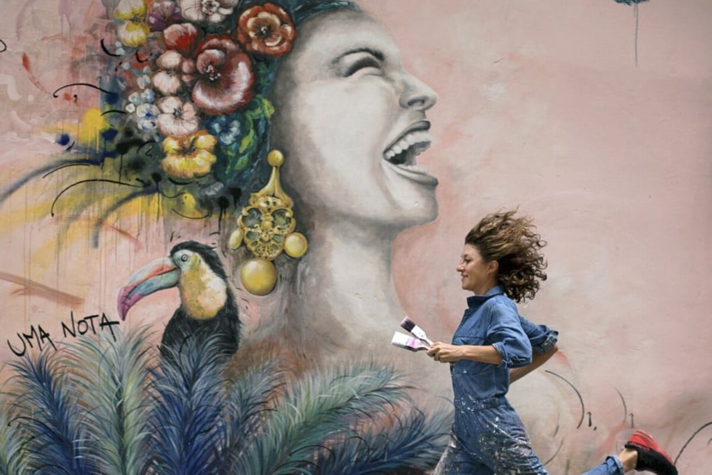 In Hong Kong, restaurants’ murals are often as photogenic as the food and drink they serve. Muralists like Elsa Jeandedieu, pictured next to her artwork on the outside of Uma Nota in Central, are kept busy.