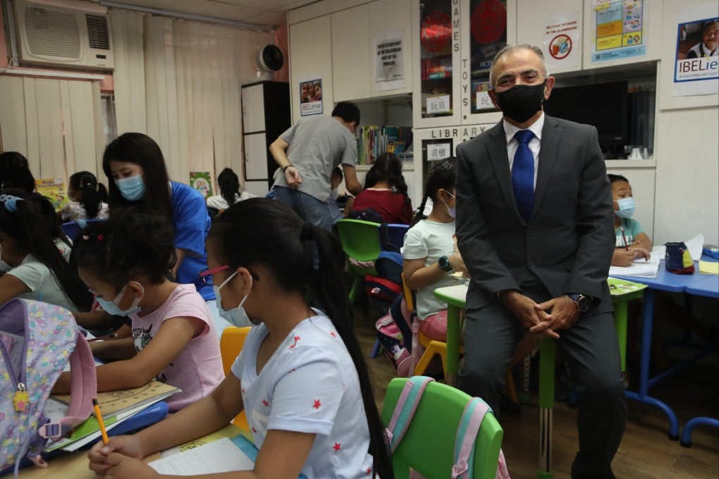 Manoj Dhar, co-founder and CEO of Integrated Brilliant Education Ltd, with the children at their centre in Jordan. Photo: Edmond So