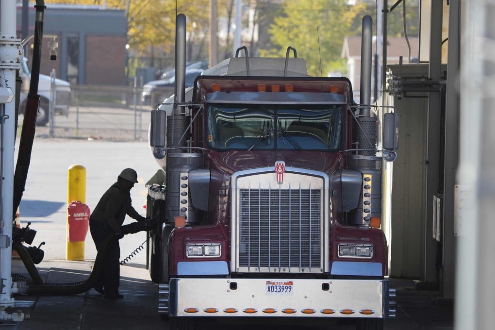 A trucker puts fuel into his truck in Salt Lake City, Utah. US President Joe Biden has ordered the release of 50 million barrels of oil from US strategic reserves in a coordinated attempt with other countries to tamp down soaring fuel prices. Photo: AFP