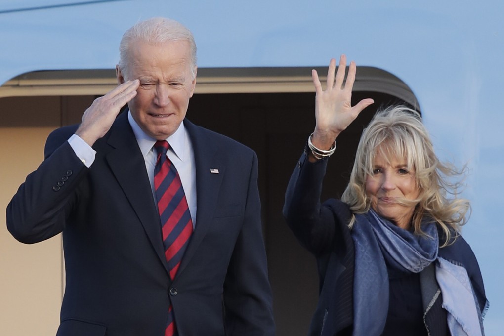 US President Joe Biden salutes as first lady Jill Biden waves from the stairs of Air Force One at Andrews Air Force Base in Maryland on Monday. Photo: AP