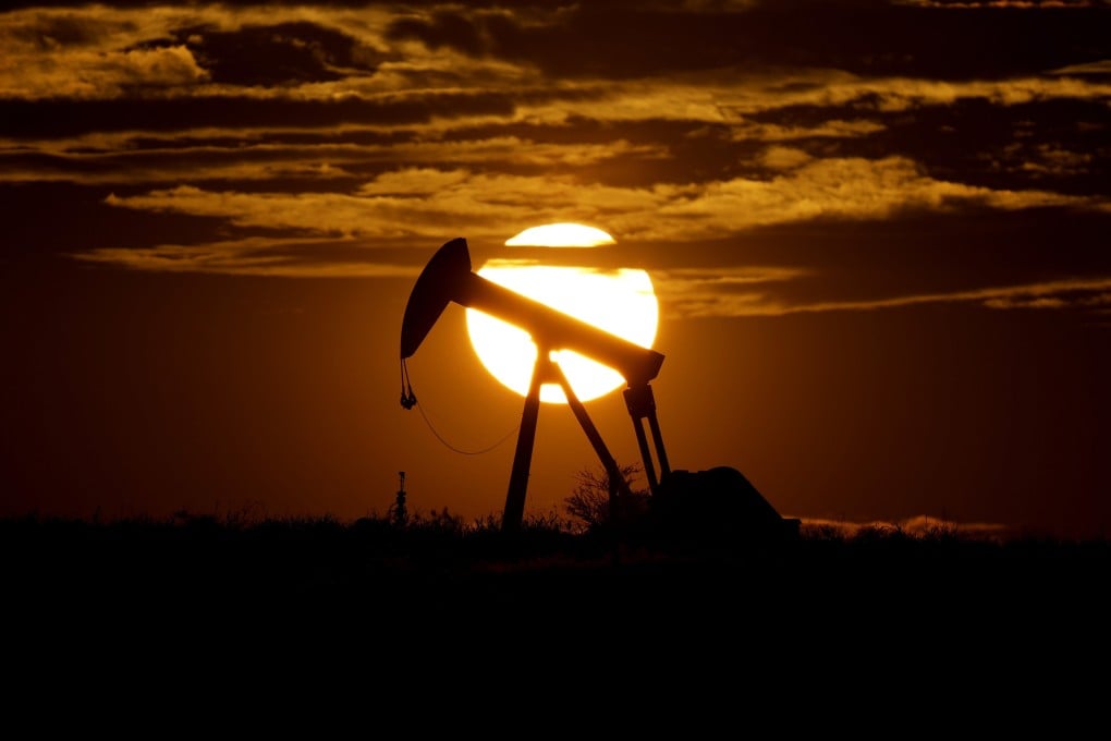 The sun sets behind an idle pump jack near Karnes City, Texas, US, on April 8, 2020. Opec+ has been reluctant – or perhaps unable – to increase production, which has helped drive crude prices ever higher amid a rebound in energy demand. Photo: AP