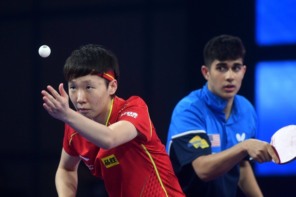 Wang Manyu of China (left) and Kanak Jha of the United States in action at the World Championships in Huston as two mixed doubles pairs between the two nations were formed to mark the 50th anniversary of the “Ping Pong” diplomacy. They beat Mariia Tailakova and Vladimir Sidorenko of Russia 3-0 in the opening round. Photo: Xinhua