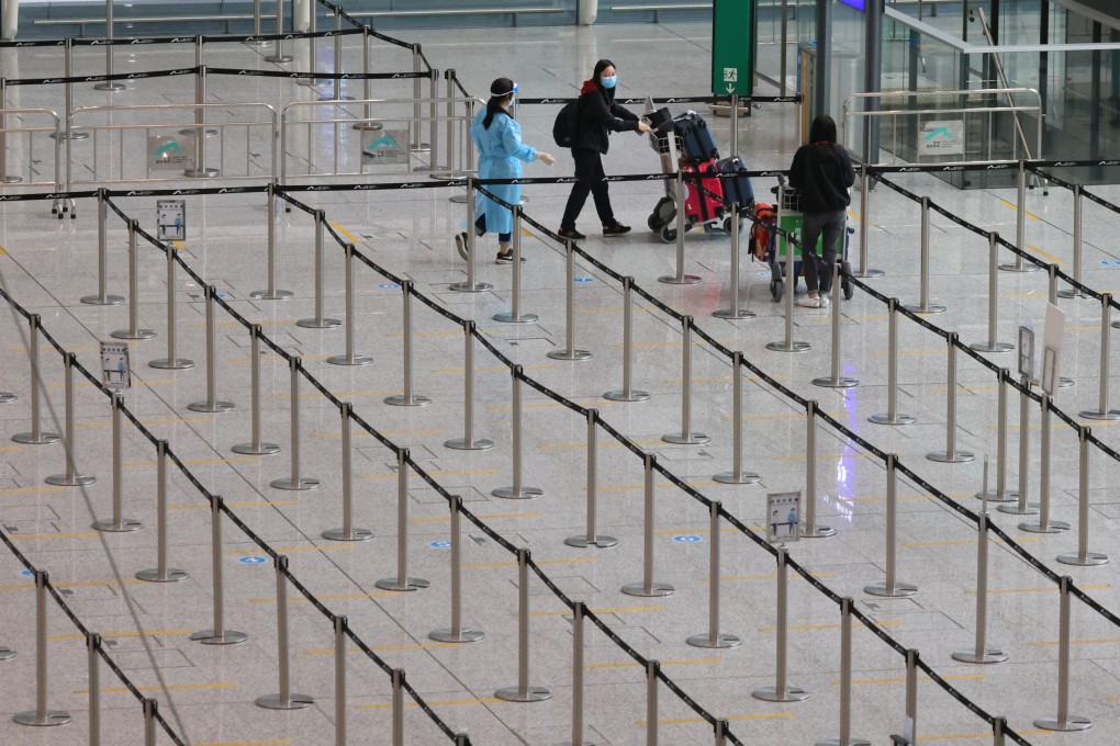 Inbound travellers arriving at Hong Kong International Airport are directed to a queue to be transported to quarantine hotels in the city. Photo: Dickson Lee