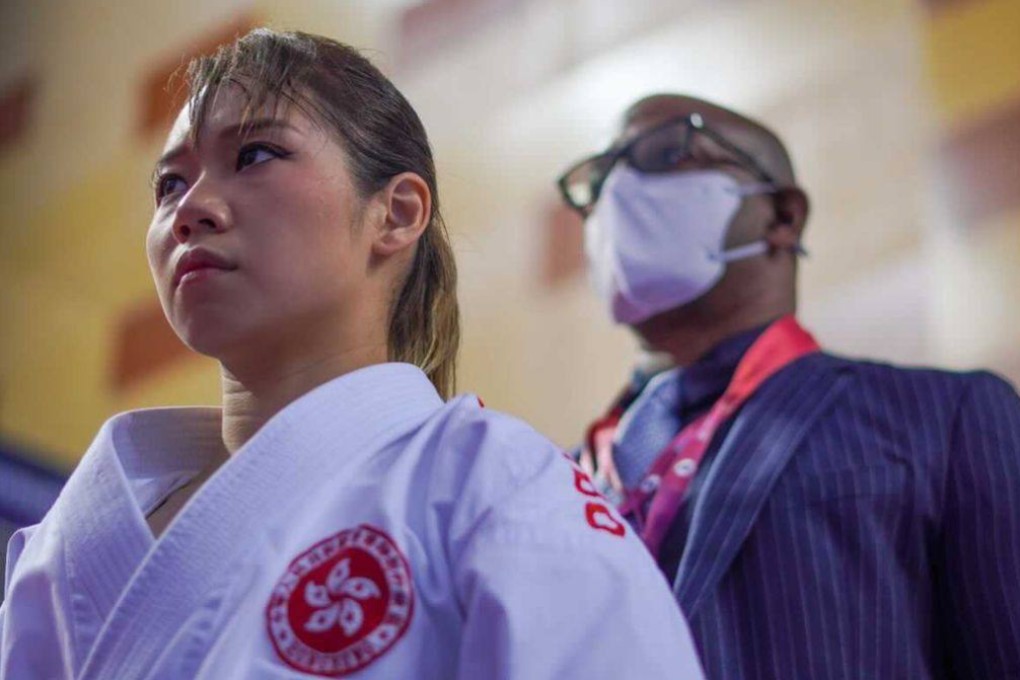Hong Kong karatedo athlete Grace Lau Mo-sheung (left) and Hong Kong Sports Institute head coach William Thomas before their bronze medal event at the Karate World Championships in Dubai. Photo: Ali Reza Sharajpour