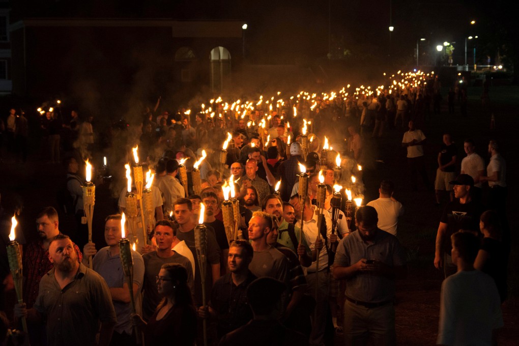 White nationalists carry torches on the grounds of the University of Virginia on the eve of a planned Unite The Right rally in Charlottesville, Virginia, in August 2017. Photo: Reuters