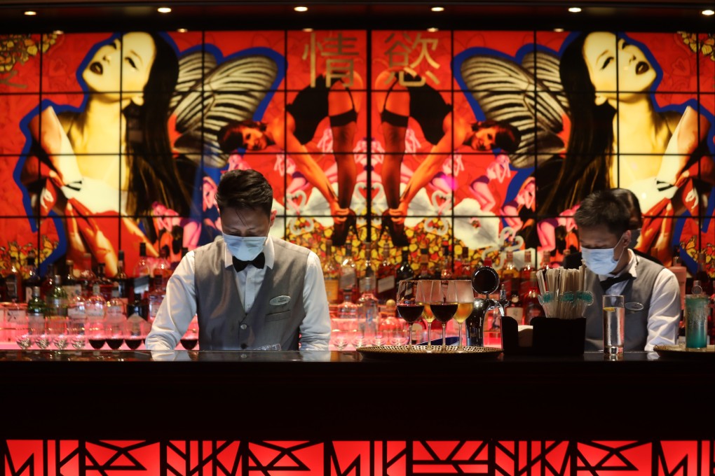 A bar tender at the Silk Road restaurant on the Genting Dream cruise ship while berthed in Hong Kong. Affluent Hongkongers are enjoying ‘cruises to nowhere’ while borders remain effectively shut. Photo: Xiaomei Chen