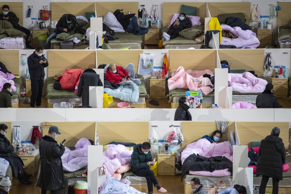 Covid-19 patients rest in wards at a makeshift hospital in Wuhan, Hubei province, in February 2020. Many of those who suffered only mild cases are now reporting breathing difficulties and other symptoms. Photo: EPA-EFE
