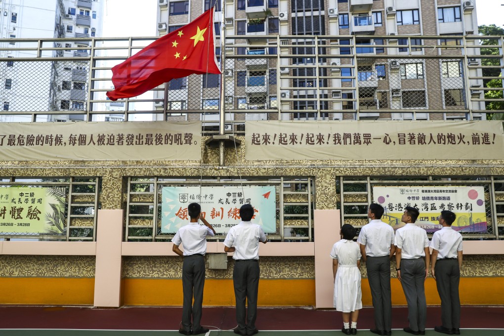 Students from a school in Hong Kong’s North Point take part in a national flag-raising ceremony back in 2019. Photo: Nora Tam