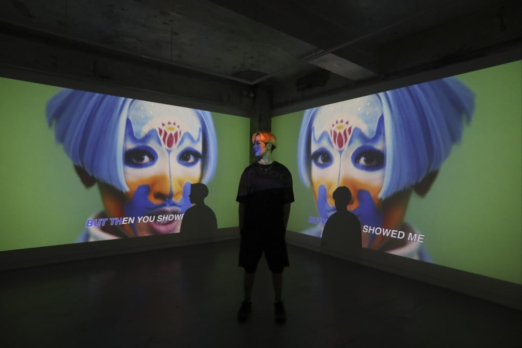 Artist Sin Wai-kin at their exhibition “It’s Always You”, at Blindspot Gallery in Wong Chuk Hang, Hong Kong, which uses boy bands such as BTS and Mirror as a basis to represent non-binary genders. Photo: Jonathan Wong