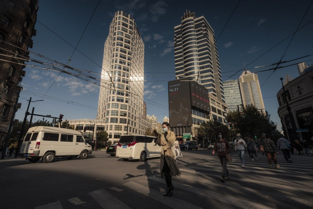 A giant screen displays stock exchange data in Shanghai. Bullish fund managers are once again loading up on selective stocks of Chinese companies. Photo: EPA-EFE