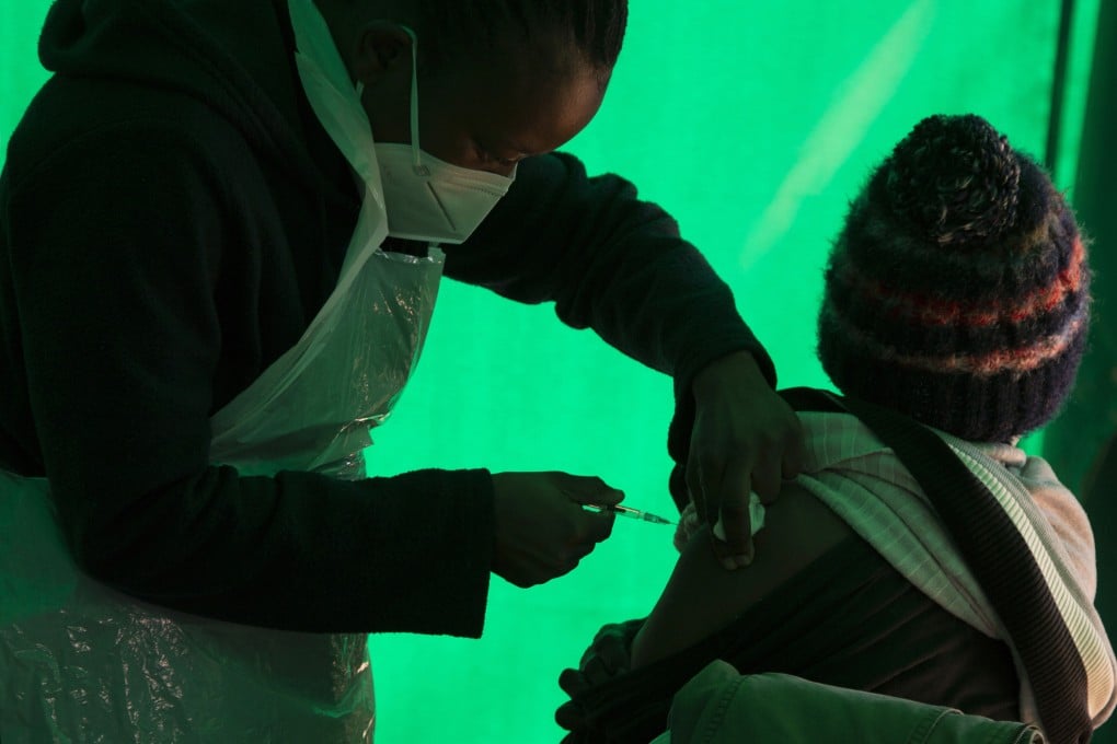 An elderly patient receives a dose of the Pfizer Covid-19 vaccine at a clinic at Orange Farm, near Johannesburg, South Africa in June. Photo: AP
