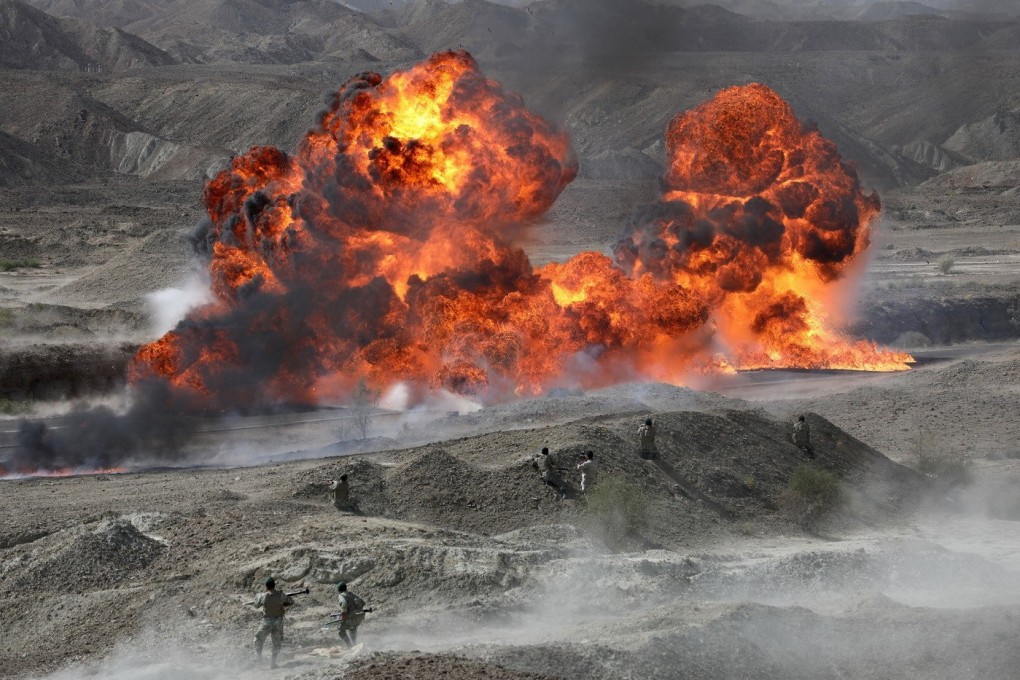 Iranian soldiers take part in a military exercise earlier this month in southern Iran. Photo: Handout via EPA