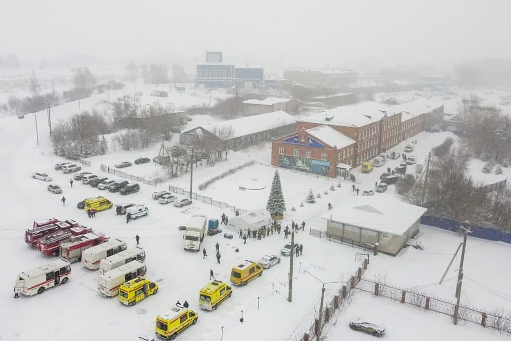 Ambulances and fire trucks are parked near the Listvyazhnaya coal mine in Siberia on Friday. Photo: Governor of Kemerovo region press office photo via AP