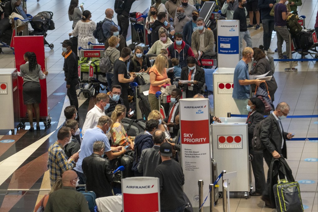 People line up to get on an Air France flight to Paris from Johannesburg on Friday as the WHO labels Omicron a variant of concern. Photo: AP