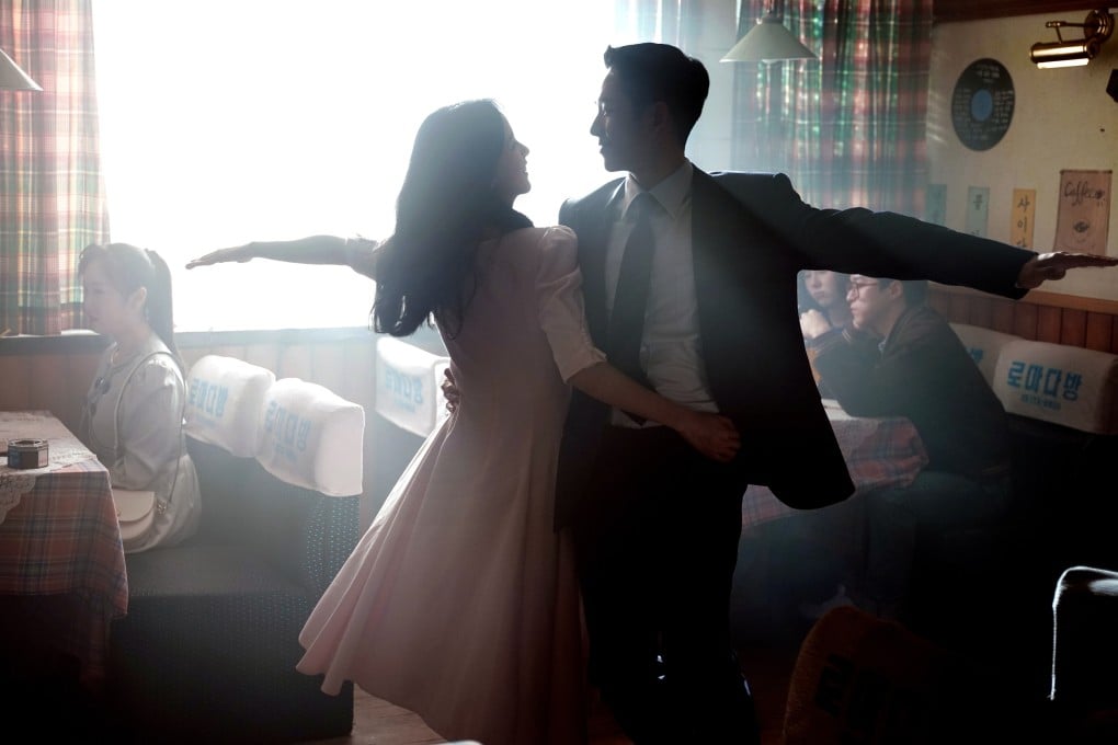 Jisoo of Blackpink (left) and Jung Hae-in in a scene from the ‘80s-set K-drama Snowdrop.