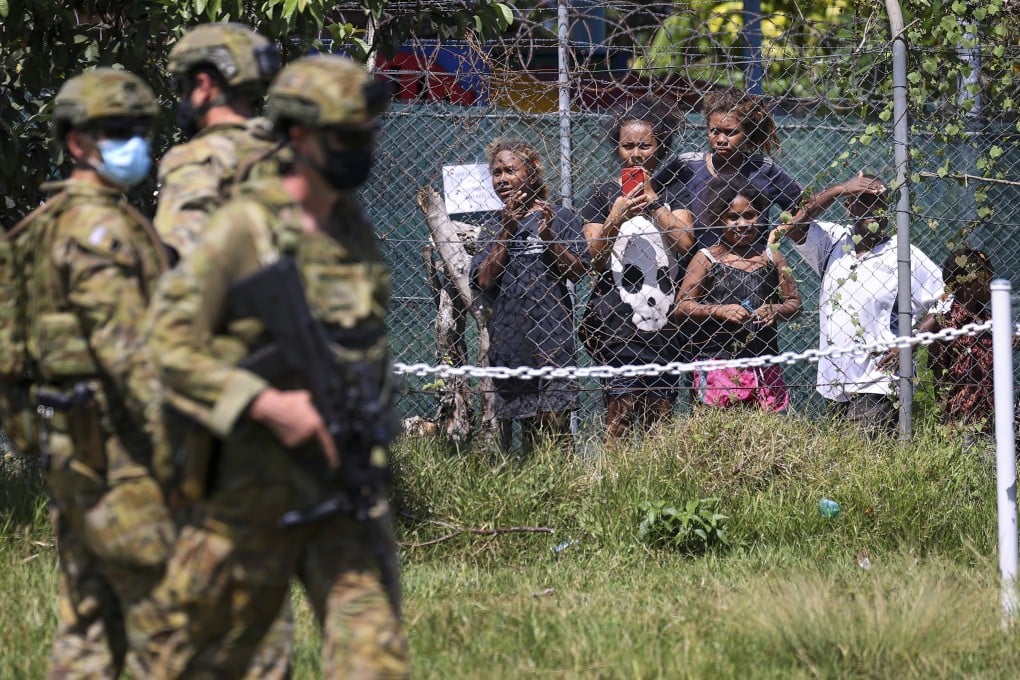 Australian soldiers and police patrol the streets in Honiara, Solomon Islands. Photo: AP