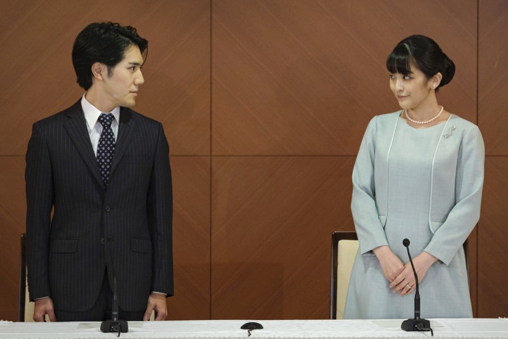 Japan’s ex-princess Mako (right) and her husband Kei Komuro during a conference to announce their marriage on October 26, 2021. Before this announcement, the palace said that she had been diagnosed with post-traumatic stress disorder (PTSD). Photo: AP