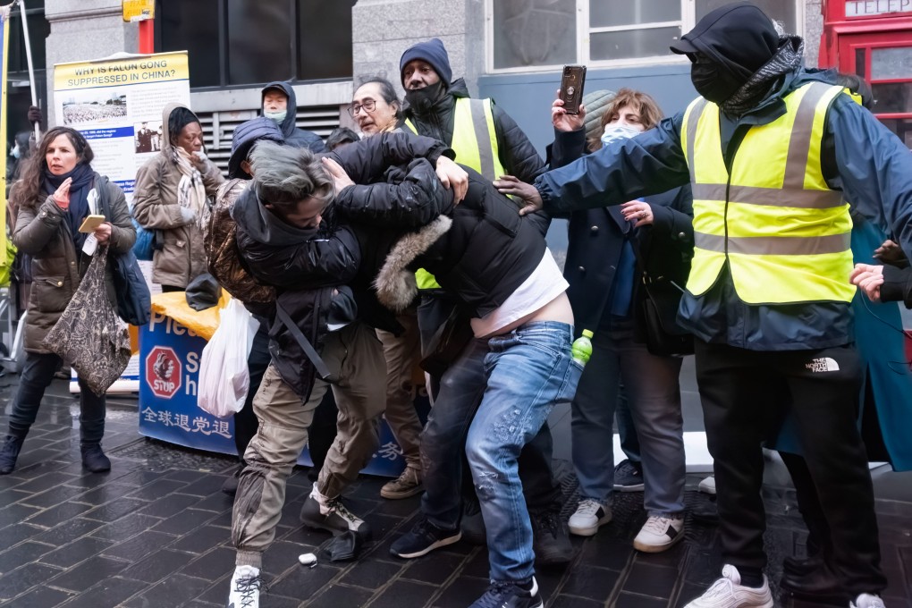 A scuffle breaks out between a pro-Beijing group and Hong Kong migrants during a rally in London’s Chinatown on Saturday. Photo: Getty Images