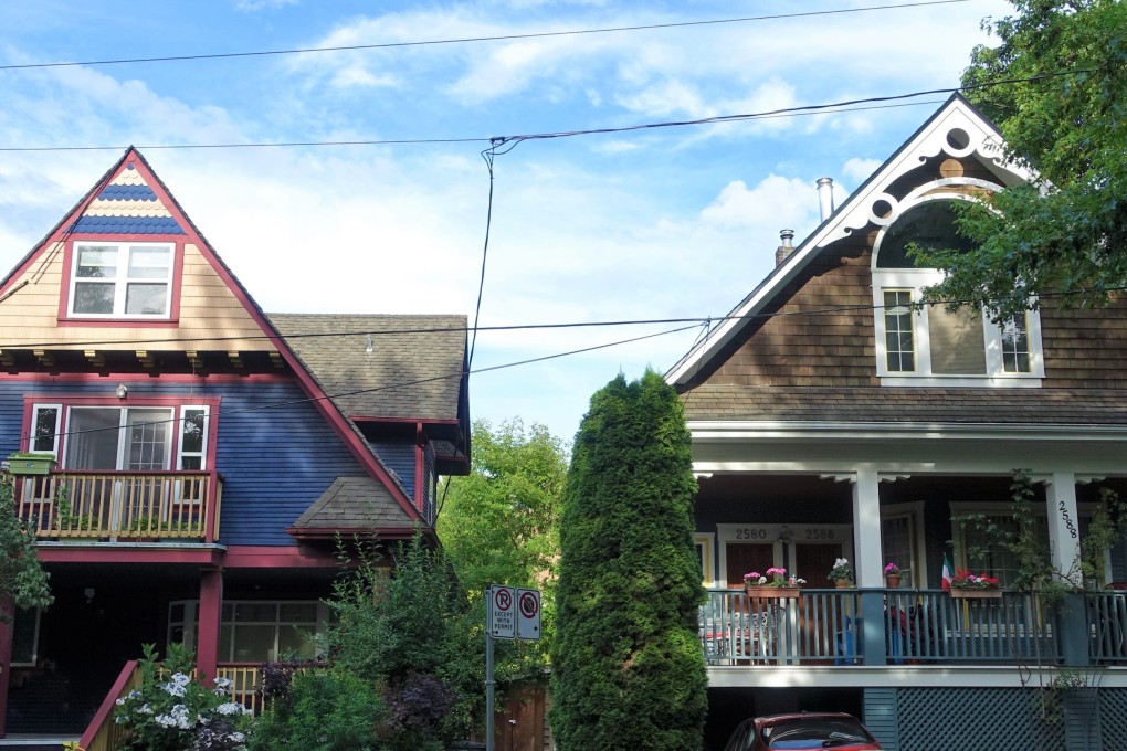 Colourful houses line a street in the Vancouver neighbourhood of Mount Pleasant. Photo: Ian Young