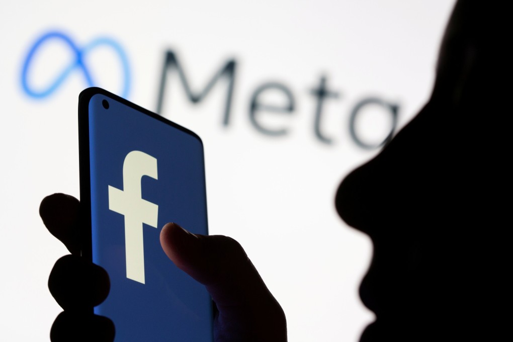 A smartphone with the Facebook logo is seen in front of the Meta logo in this illustration picture taken October 28, 2021. Photo: Reuters